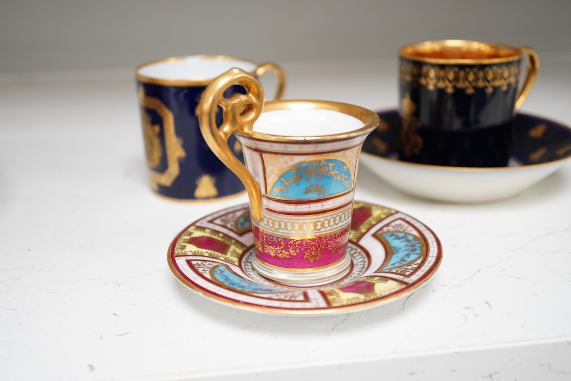A 19th century Sevres style Napoleon cup, together with a similar cup and saucer and a Naples cup and saucer, cup 8cm from top of handle to base.